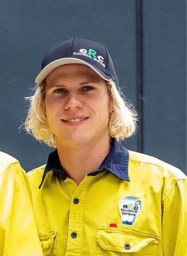 ERC Electrical Services employee in yellow uniform.