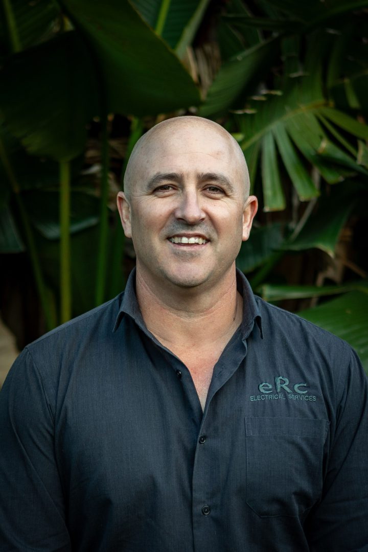 Smiling man in ERC Electrical Services shirt